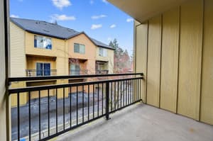 Balcony with metal railing, covered space at Glisan Townhomes, 17218-17298 NE Glisan St, Gresham, Oregon 97230