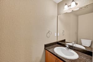 Bathroom with granite countertops at Glisan Townhomes