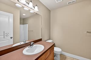 Bathroom with vanity mirror, overhead lighting at Glisan Townhomes, 17218-17298 NE Glisan St, Gresham, Oregon 97230