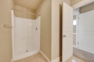 Bathroom with walk-in shower at Glisan Townhomes