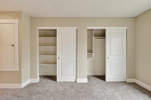 Bedroom with built in closets, sliding doors at Glisan Townhomes, 17218-17298 NE Glisan St, Gresham, Oregon 97230