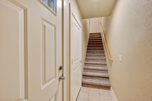 Hallway with carpeted stairs, textured walls at Glisan Townhomes, 17218-17298 NE Glisan St, Gresham, Oregon 97230