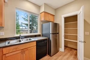 Kitchen with stainless steel appliances, granite countertops at Glisan Townhomes, 17218-17298 NE Glisan St, Gresham, Oregon 97230
