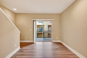 Living Room with sliding glass door, hardwood floors at Glisan Townhomes, 17218-17298 NE Glisan St, Gresham, Oregon 97230