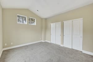 Bedroom with carpeted floor, vaulted ceiling at Glisan Townhomes, 17218-17298 NE Glisan St, Gresham, Oregon 97230