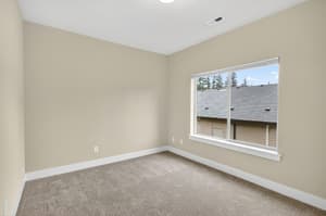 Bedroom with carpeted floor at Glisan Townhomes