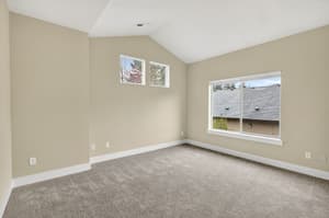 Bedroom with carpeted floor, large window at Glisan Townhomes, 17218-17298 NE Glisan St, Gresham, Oregon 97230
