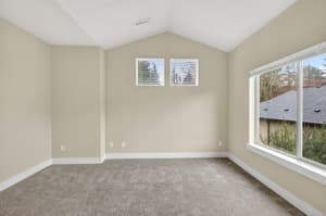 Bedroom with carpeted floor, large windows at Glisan Townhomes, 17218-17298 NE Glisan St, Gresham, Oregon 97230