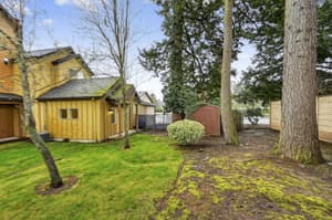 Exterior with lush trees, green lawn at Glisan Townhomes, 17218-17298 NE Glisan St, Gresham, Oregon 97230