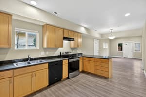 Kitchen with granite countertops, stainless steel appliances at Glisan Townhomes, 17218-17298 NE Glisan St, Gresham, Oregon 97230