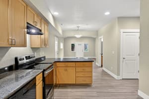 Kitchen with granite countertops, stainless steel appliances at Glisan Townhomes, 17218-17298 NE Glisan St, Gresham, Oregon 97230