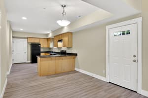 Kitchen with wood cabinets, granite countertops at Glisan Townhomes, 17218-17298 NE Glisan St, Gresham, Oregon 97230