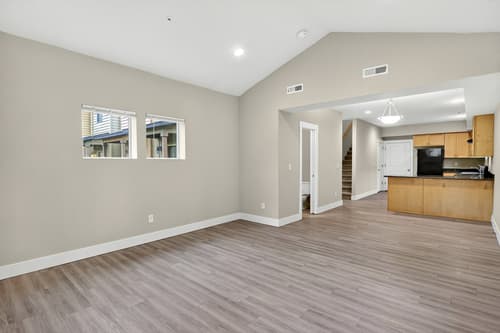 Living room with vaulted ceiling at Glisan Townhomes