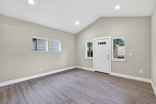 Living room with recessed lighting at Glisan Townhomes