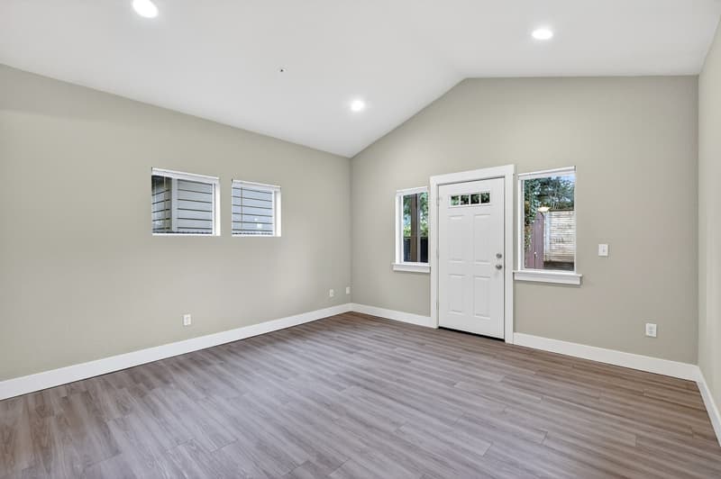Living room with recessed lighting at Glisan Townhomes