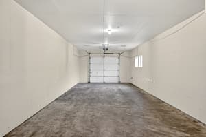 Storage with concrete floor, garage door at Glisan Townhomes, 17218-17298 NE Glisan St, Gresham, Oregon 97230